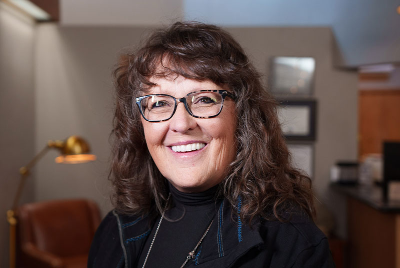 dental implant patient smiles after