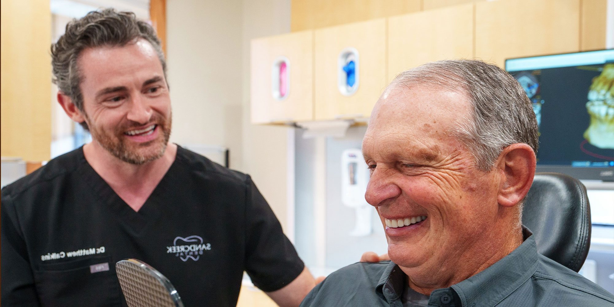 doctor with dental implant patient after surgery