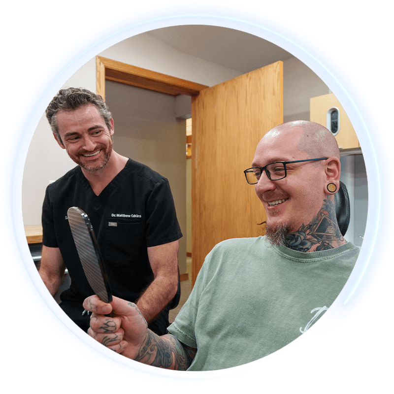 doctor with smiling dental patient