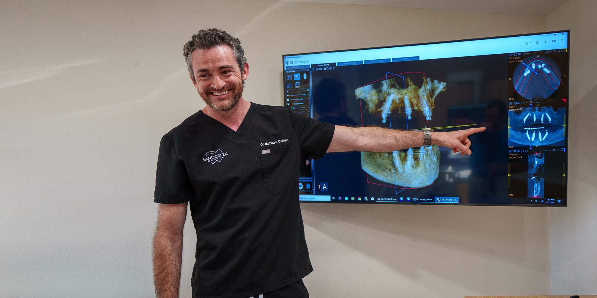 dr pointing to dental xray